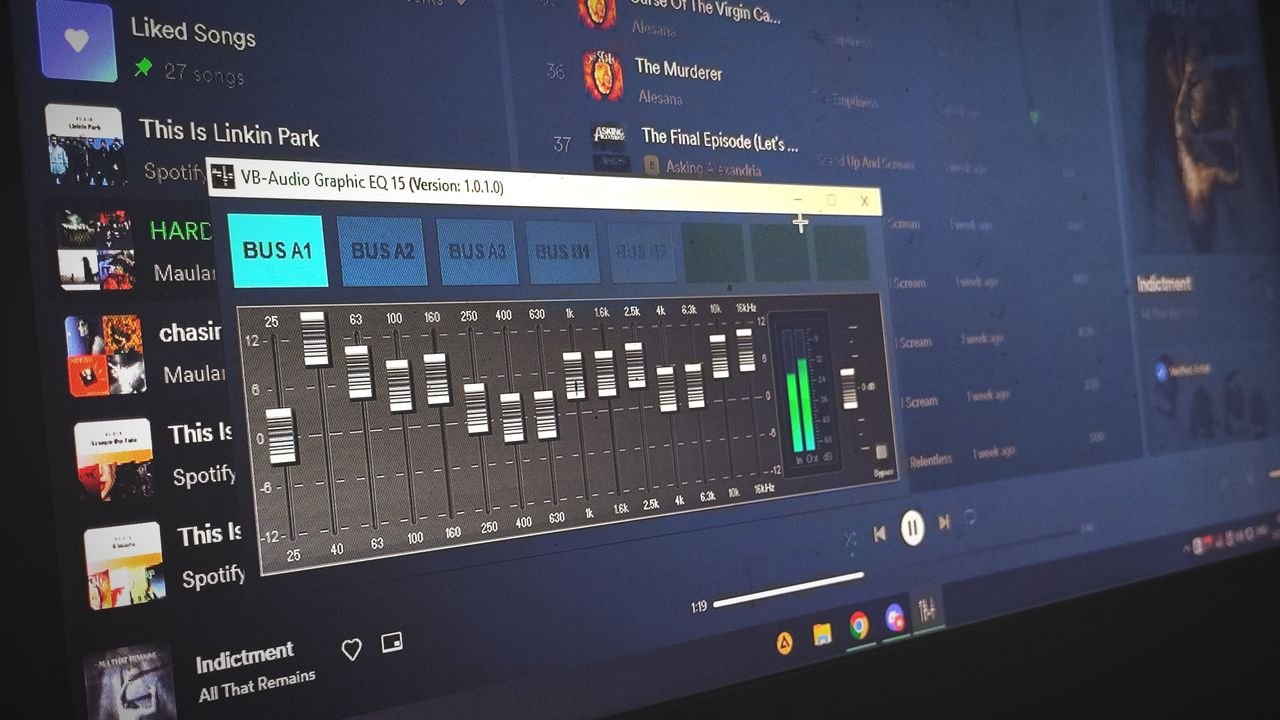 Services Close-up of a digital audio graphic equalizer on a laptop screen for music editing.