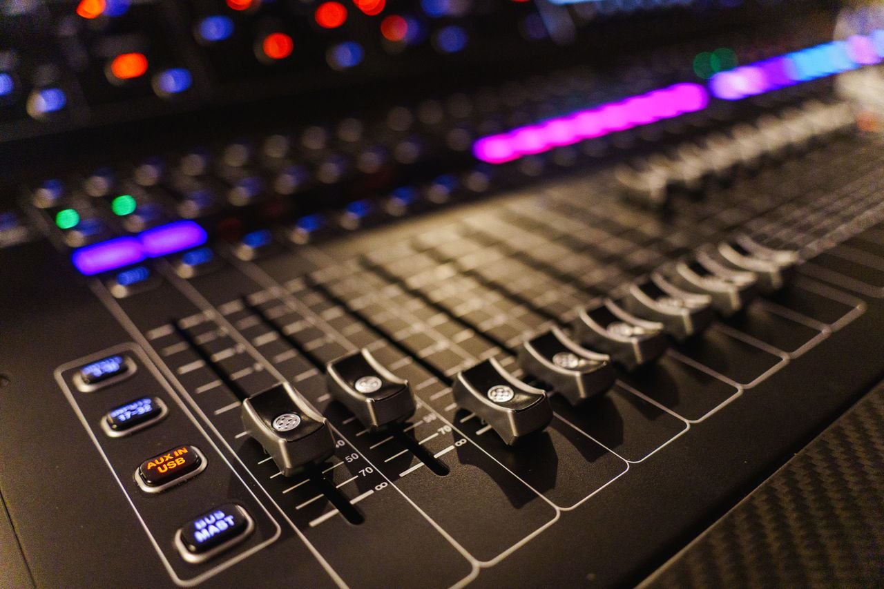 About Detailed view of an advanced audio mixing console, perfect for studios.